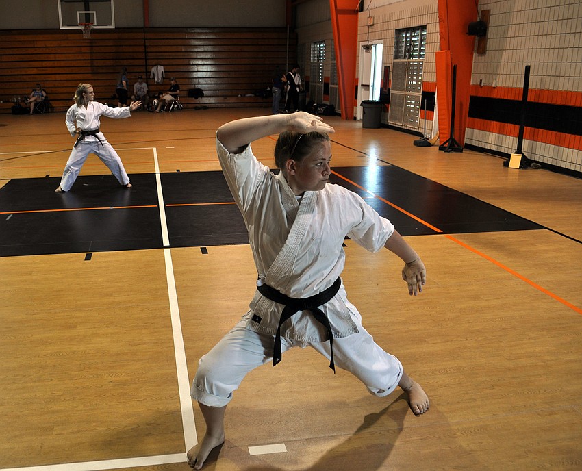 Jazmyn Friedman demonstrates her kata, which is a series of choreographed martial arts techniques.