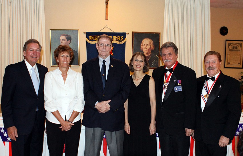 Honorees Scott Bill, Mary Potter, Jay Foutty, LTC Pam Meyers, Sal Naimo pose with Tom Dineen, Saturday, May 12, at the 29th Annual Patriotic Ball at the Knights of Columbus Hall.