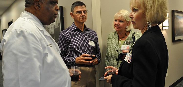 Dr. Randall Morgan, left, spoke with Lakewood Ranch Medical Centerâ€™s Dr. Linda Widra, right, about the new office.