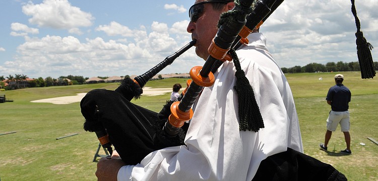 Gary Reinstrom, of the Jacobites Pipe & Drum Band, kept the mood lively as the golfers began the tournament.