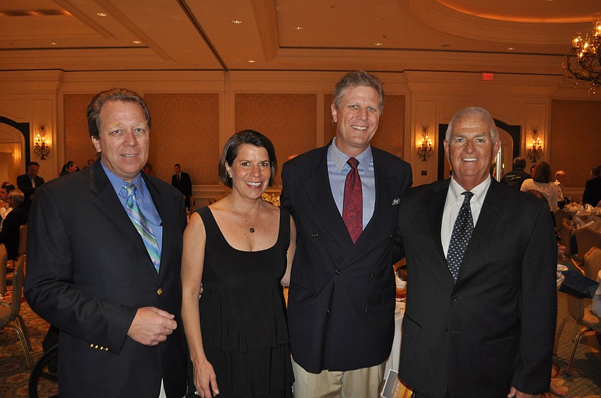 Chairs Chuck and Diann Flanders with president John Leeming and president elect Thomas Maryott