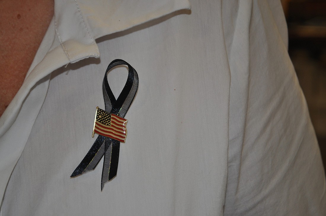Longboat Key Deputy Town Clerk Jo Ann Mixon is one of many town employees who wore a black ribbon Monday, May 21 in honor of Police Chief Al Hogle.