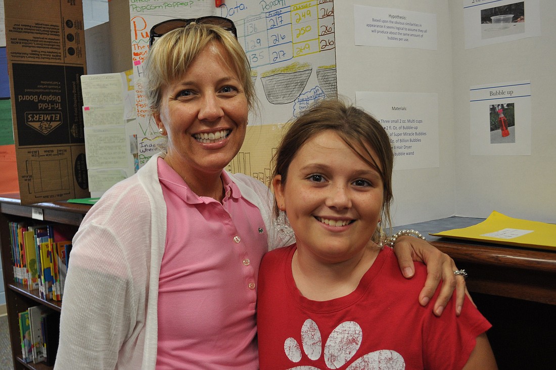 Libby Moser, pictured with her mom, Erin, received honorable mention for her bubble-blowing project.