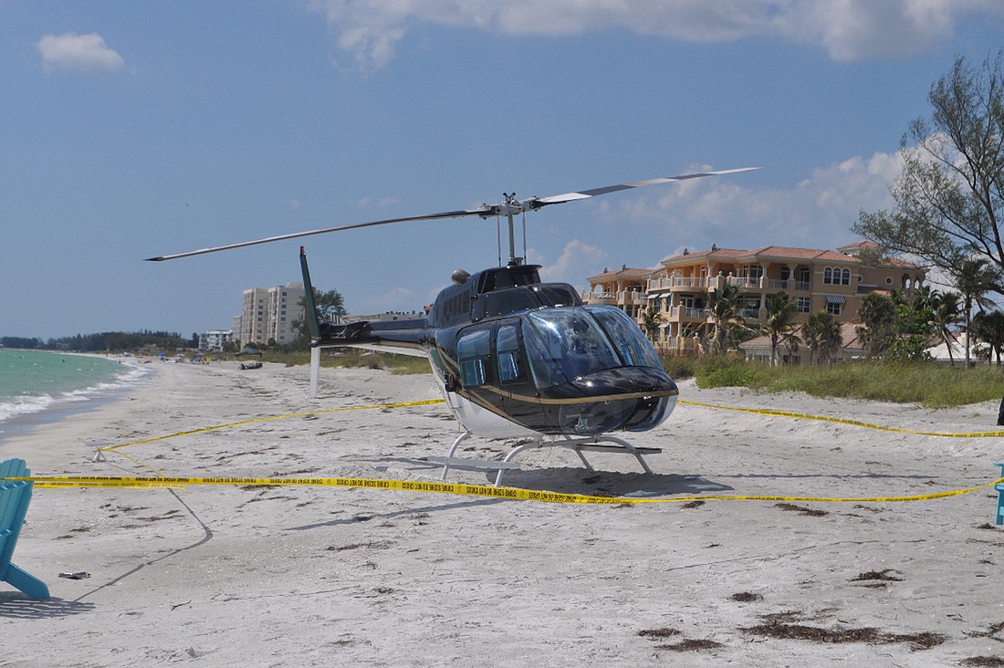 The Bell helicopter landed on the Key's Gulfside beach near the 4000 block of Gulf of Mexico Drive.