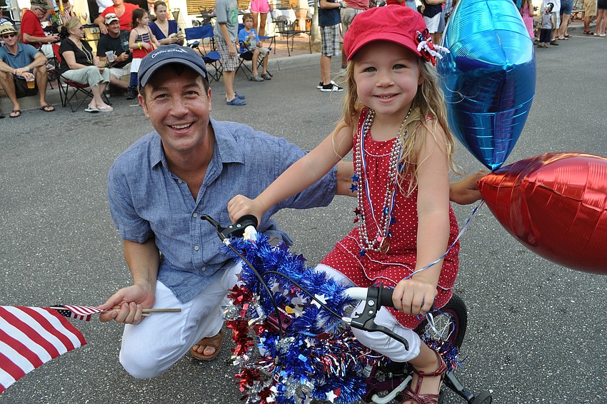 John Gio walked alongside his daughter, Gianna, who participated in the bicycle brigade.