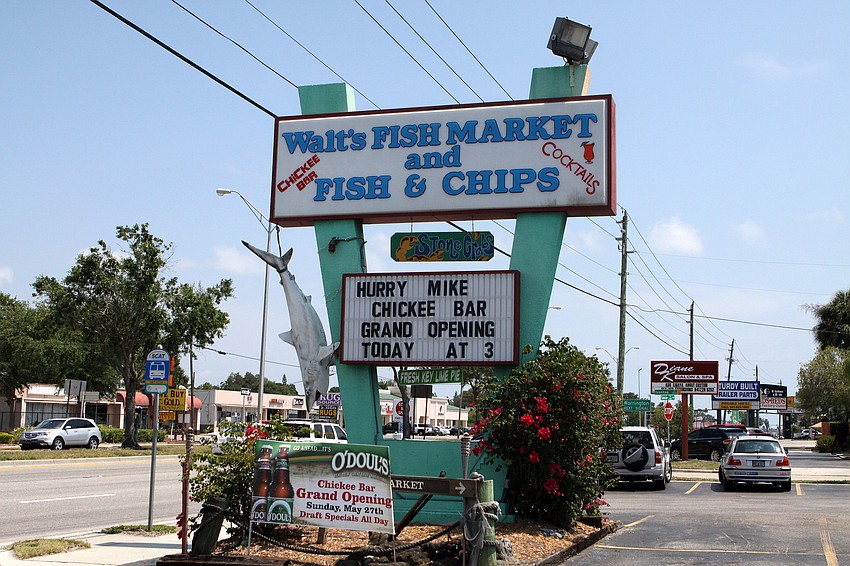 The billboard at Waltâ€™s Fish Market announced the grand opening of their new Chickee Bar.