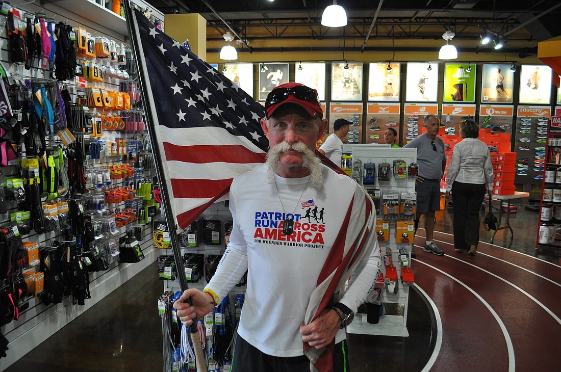 John Pyle celebrated the completion of his 3,144-mile run to benefit the Wounded Warrior Project at Fit2Run.