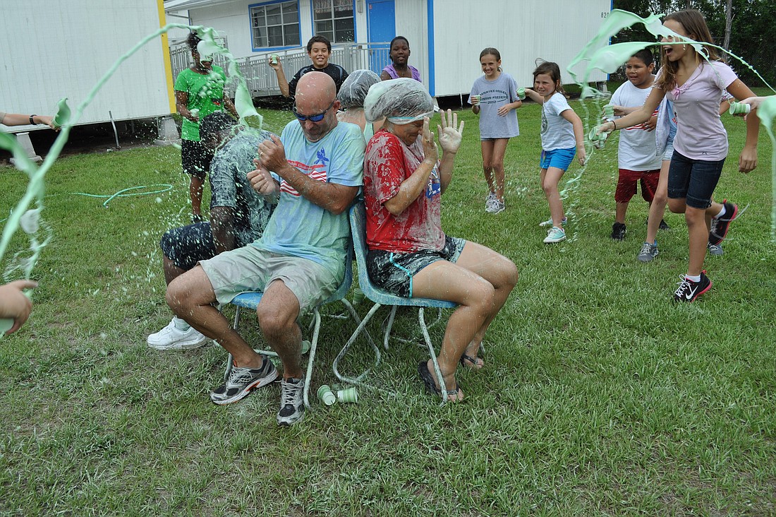Freedom Principal Jim Mennes and fourth-grade teacher Amanda Hirst got drenched with slime.