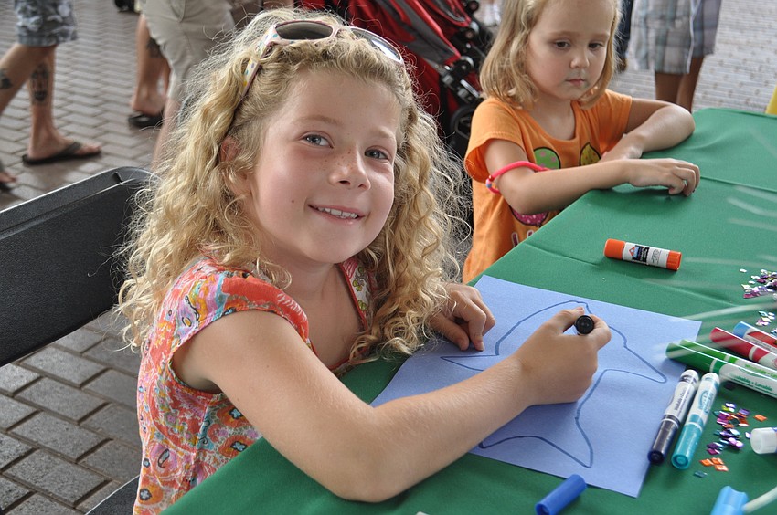 Kate Carver colors a fish