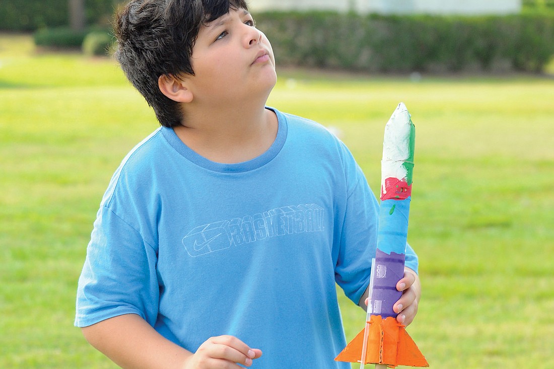 Eleven-year-old Cesar Sandelis put extra time and effort into building his model rocket. Photo by Jen Blanco.