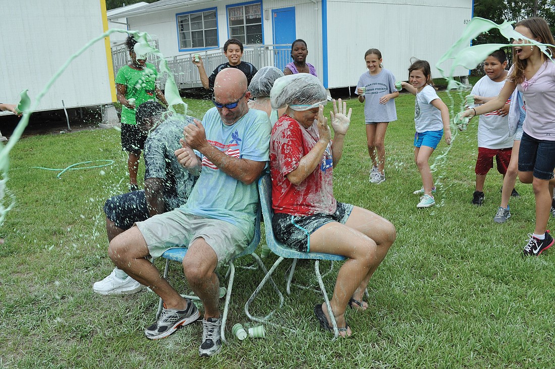 Freedom Principal Jim Mennes and fourth-grade teacher Amanda Hirst got drenched with slime.