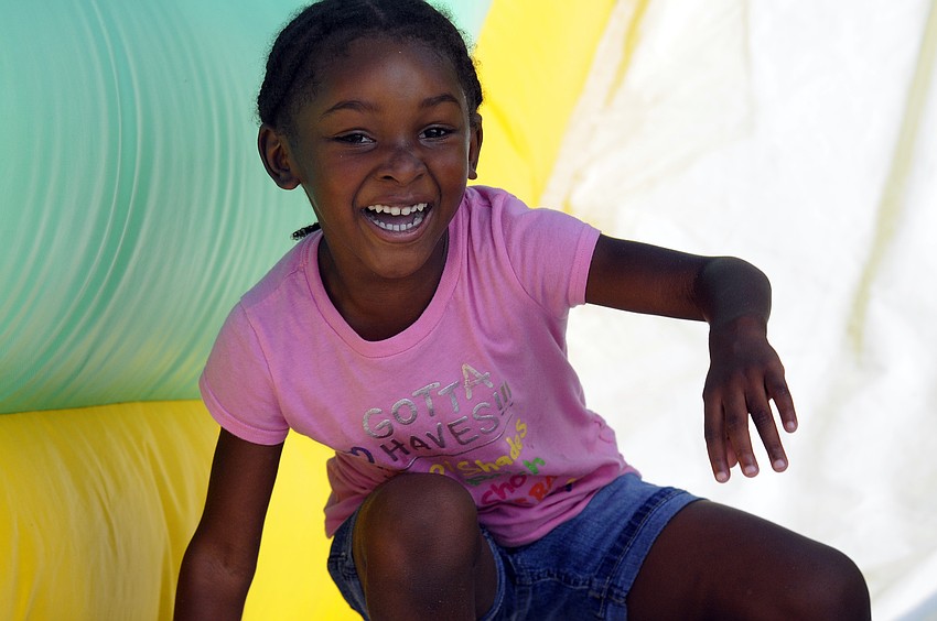 Five-year-old Kamiah Belvin couldnâ€™t wait to play on the bounce houses.