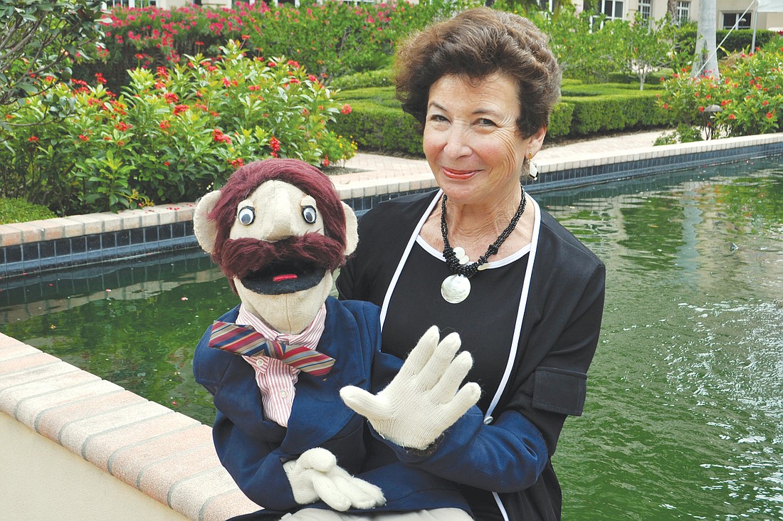 Jill Ross poses with the first puppet she built, which she named Jerry. Ross built the puppet using Jim HensonÃ¢â‚¬â„¢s technique.