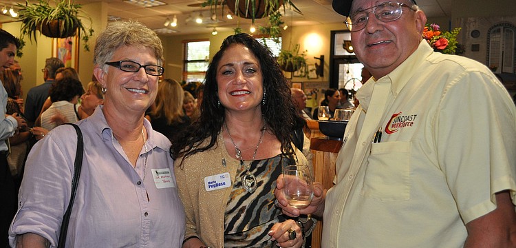 Sue Redfield, of Canine Massage Solutions, with Maria Pugliese, of Brighthouse, and Peter Kiziu, of Suncoast Workforce