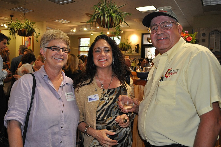 Sue Redfield, of Canine Massage Solutions, with Maria Pugliese, of Brighthouse, and Peter Kiziu, of Suncoast Workforce