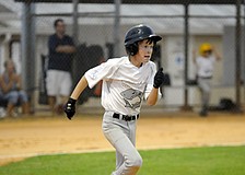 Cooper Corley, 11, hit a RBI double for Carroll and Sutton.