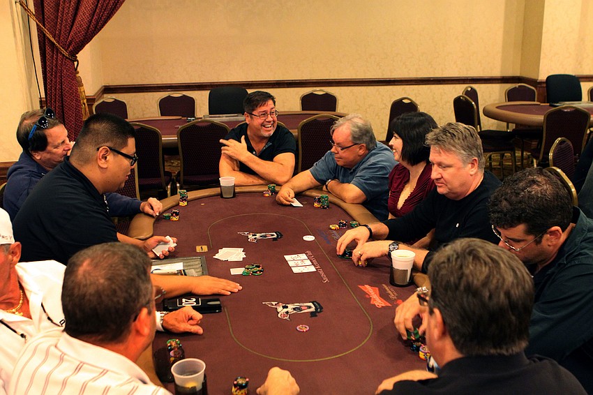 Participants laugh and have fun as they enjoy themselves, Thursday, June 7, during the Siesta Key Chamber of Commerce Poker Tournament.