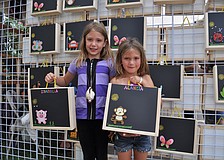 Isabella and Alancia Cox show off their purchase.