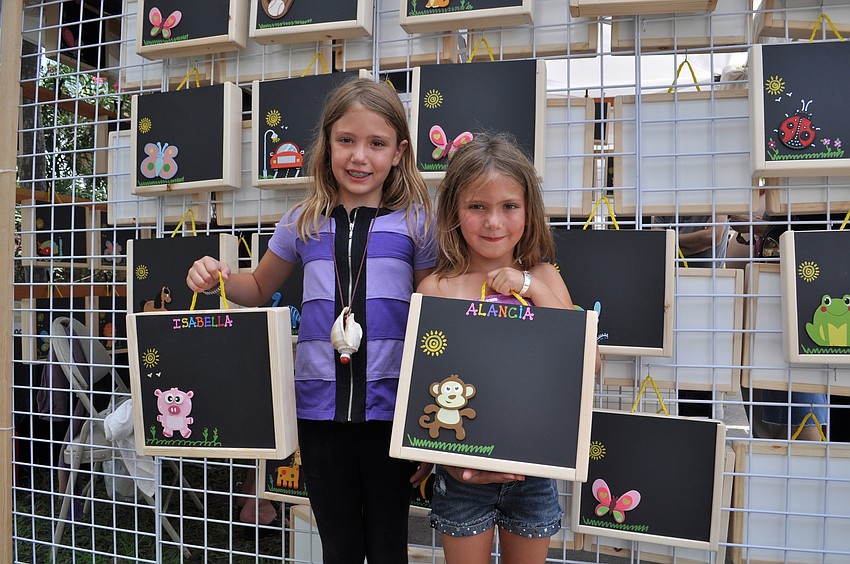 Isabella and Alancia Cox show off their purchase.