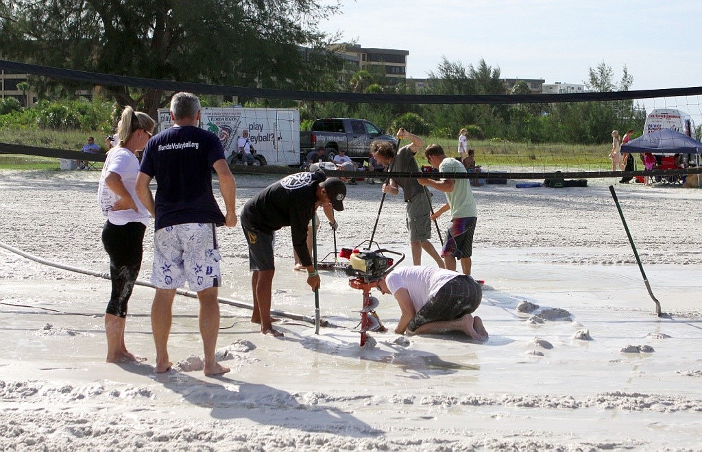 Dig the Beach volleyball tournament organizers took a unexpected trip to Home Depot and bought tools to clear water from Siesta Key Beach volleyball courts.