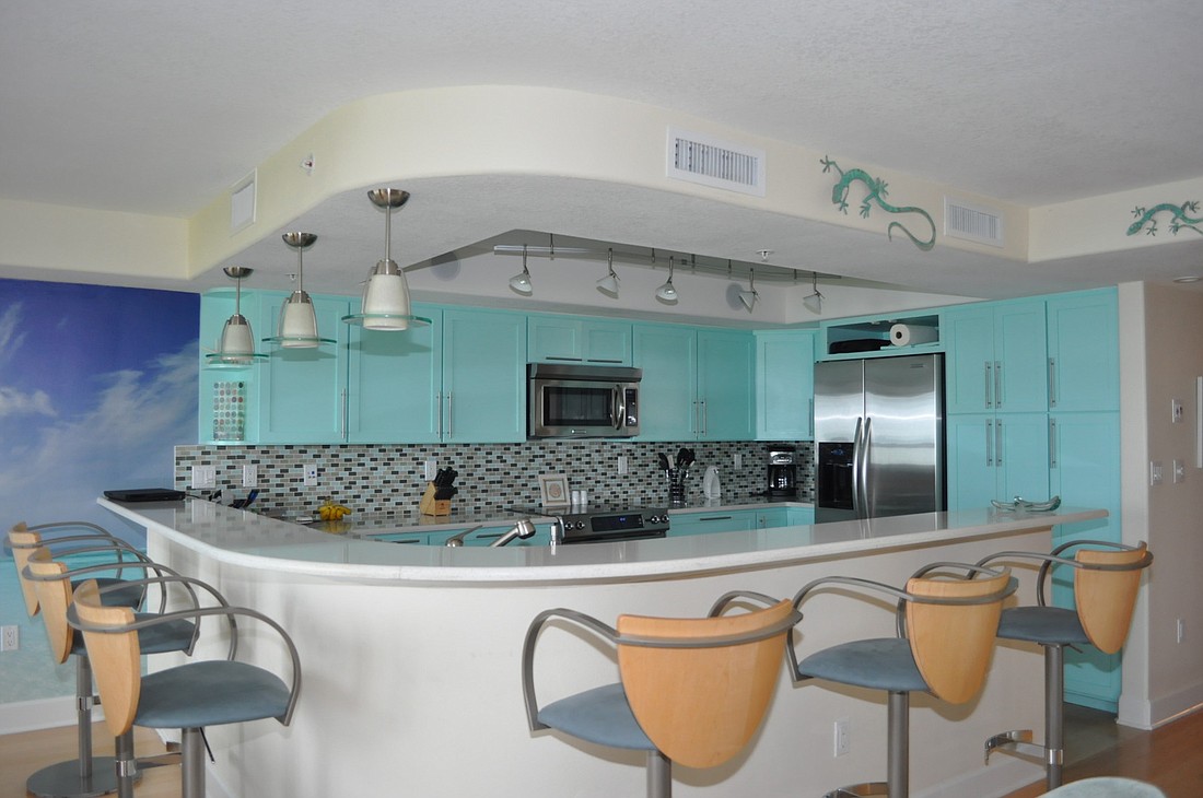 "Jeff just said, 'Beach,' so I decided to go with aqua. Every contractor who walked through said, 'What are you thinking?' I knew I could pull it all together by lightening up the countertops." Ã¢â‚¬â€Ã‚Â Debbie Wagner