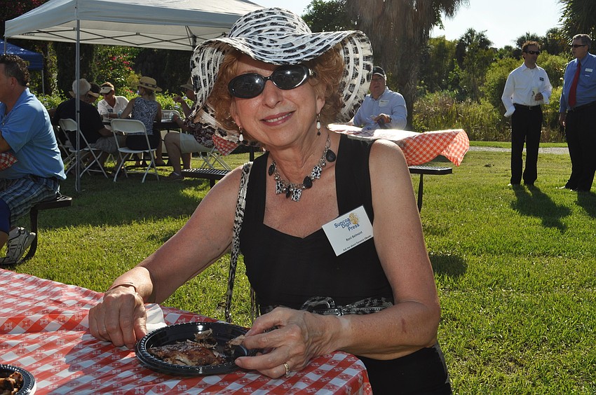 Roni Belmont with Suncoast Digital Press enjoys some ribs from Anna Maria Oyster Bar.