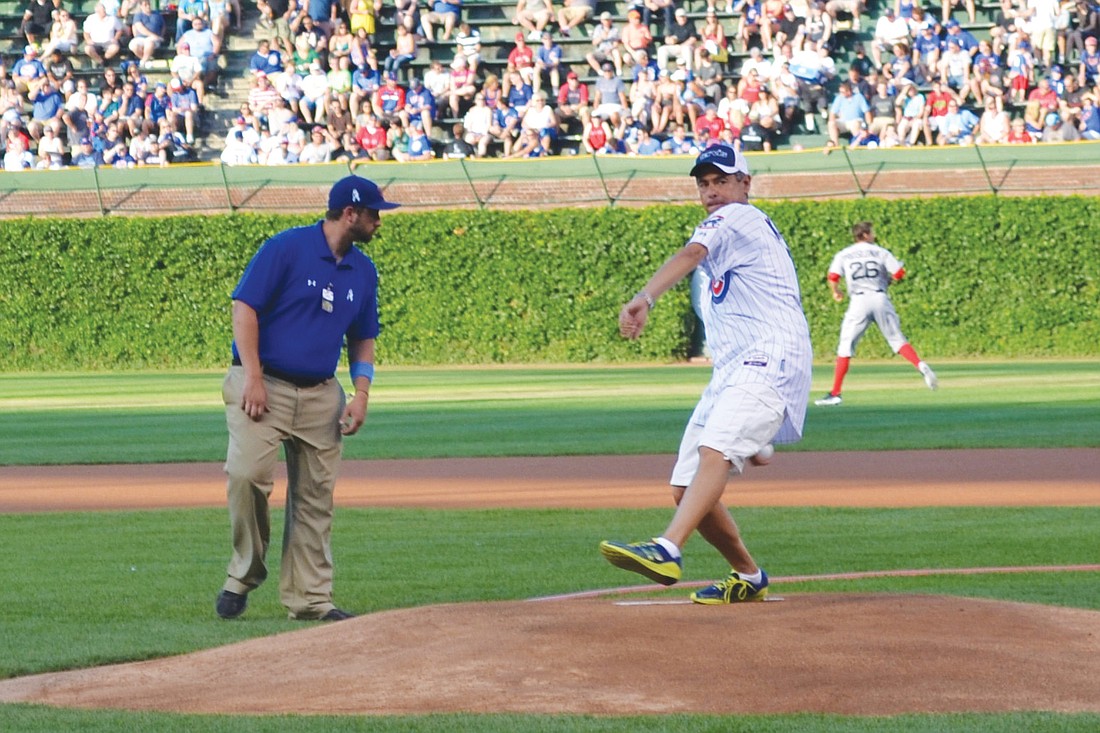 Rich Kaplan throws out the ceremonial first pitch of the Chicago Cubs game Sunday, at Wrigley Field. Courtesy photos.