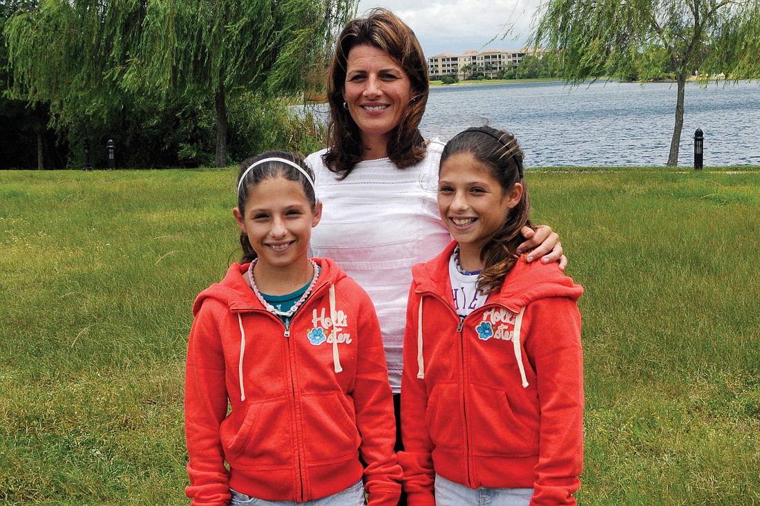 Julie Fazio, pictured with her 12-year-old twin daughters, Sarah and Emma, will run in the New York City Marathon for Families of Spinal Muscular Atrophy in honor of her son, Frankie.