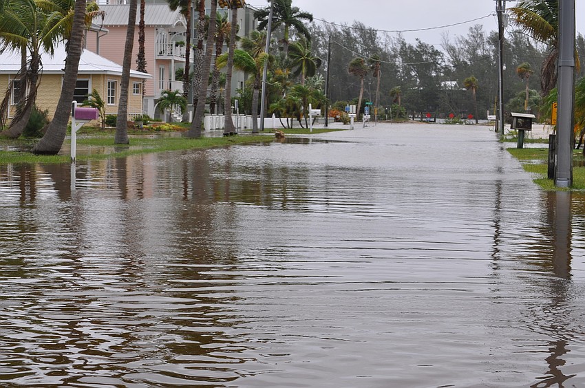 Longbeach Village residents had to park their cars on high land and wade to their homes.