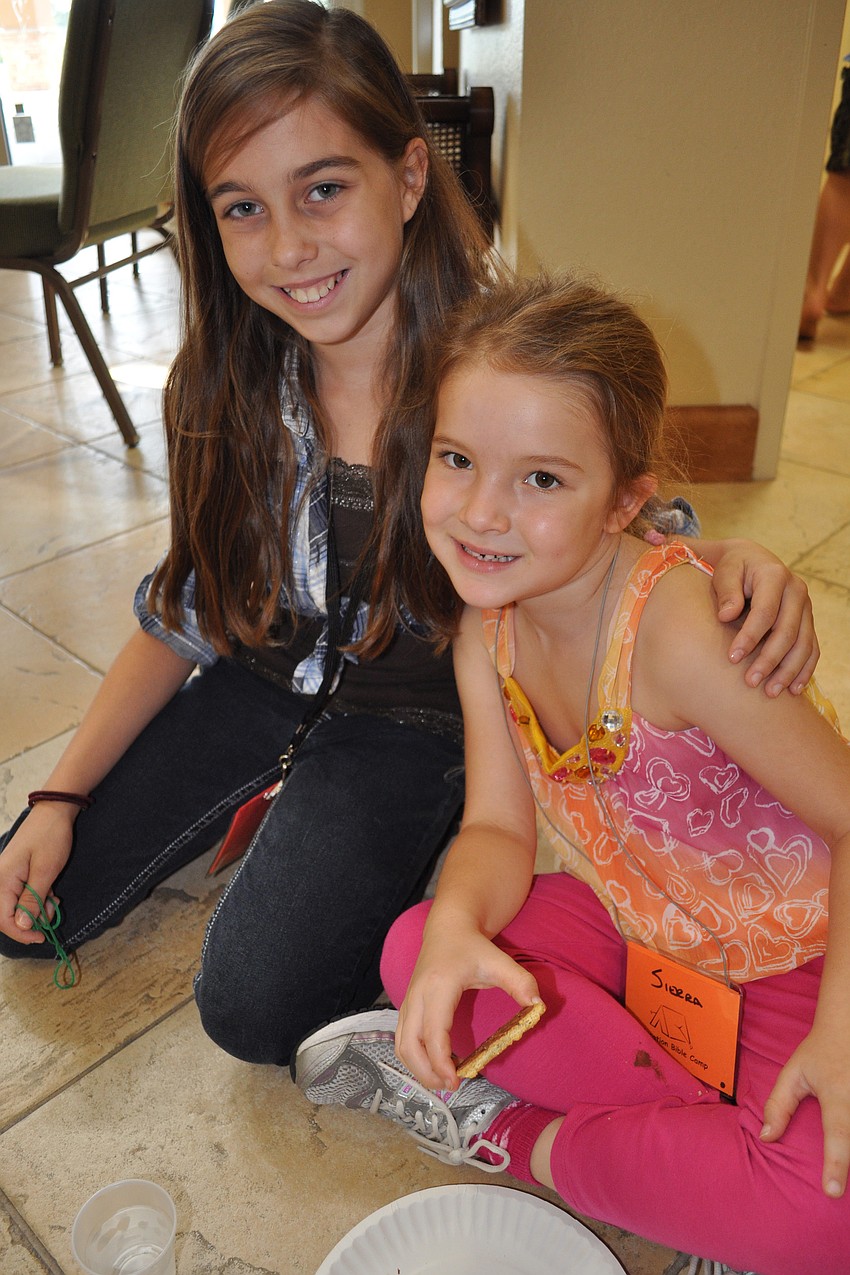 Morgan Corbridge, 11, spent snack time with Sierra Yoemans.