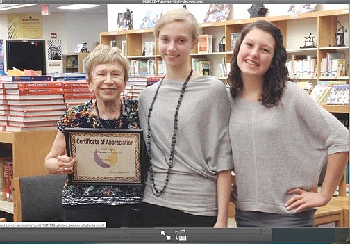 Sonia Pressman Fuentes presents Caitlin Gish and Kaley deLeon with copies of her memoirs. Courtesy photo.