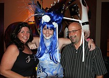 Rachel Rohn, center, poses with her parents Jodi Westgate and Kurt Rohn.