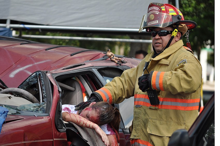 East Manatee Fire Rescue Firefighter Joe Griffith checked on a crash victim during a simulation.