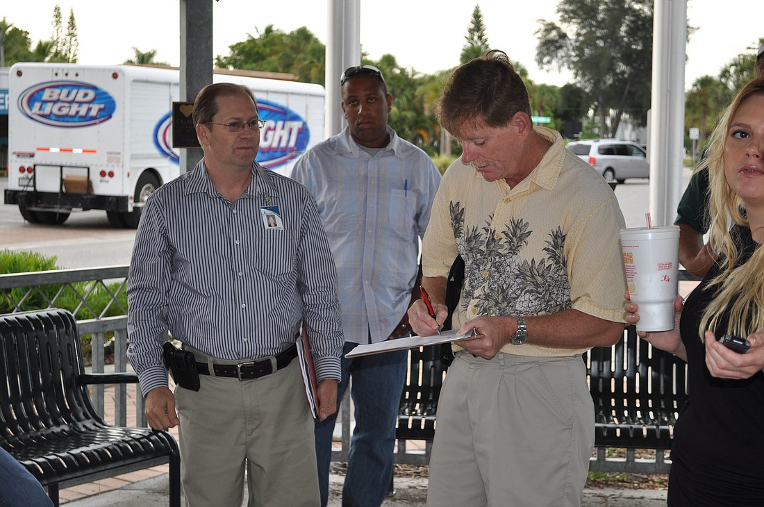 Mark Smith, right, is one the board of directors of the Siesta Key Village Maintenance Corp.