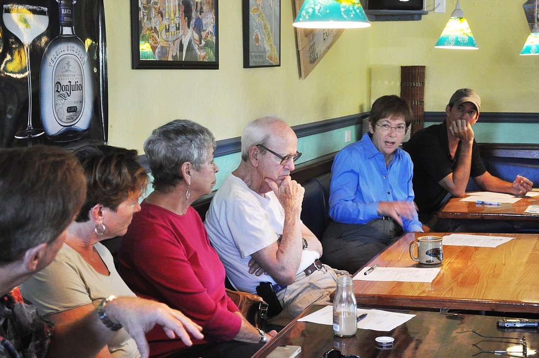 Sarasota County Commissioner Nora Patterson explains to members of the Siesta Key Village Association that Sarasota County is running a budget deficit.