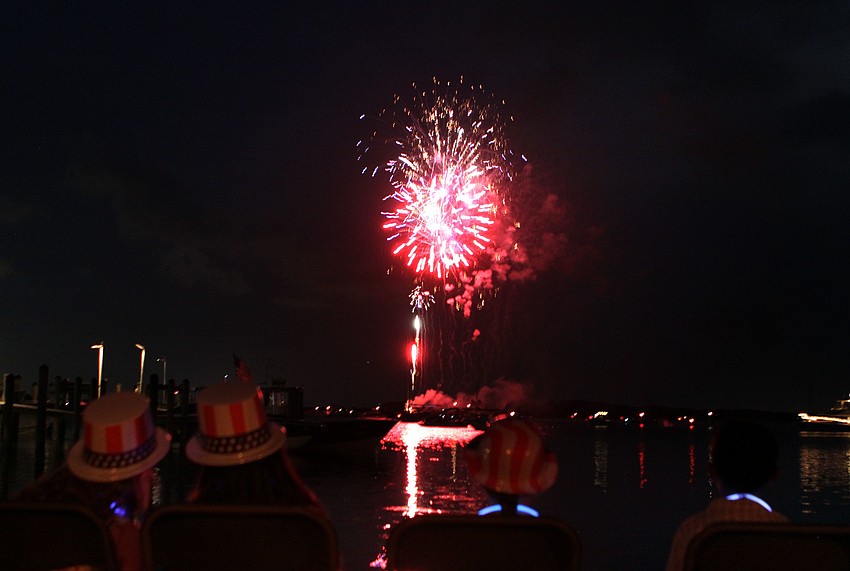 Children wore patriotic, plastic hats while sitting on the beach at Mar Vista, Monday, July 2, during the 4th annual Boom Boom on the Bay.