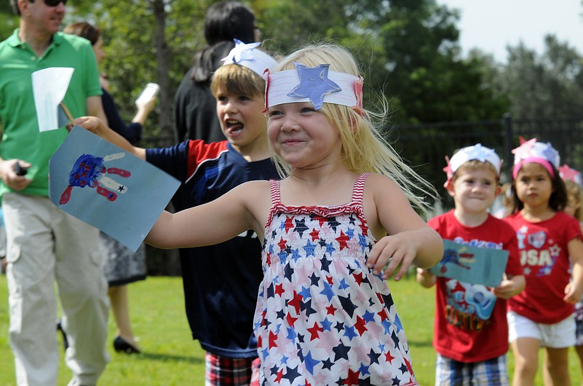 Four-year-old Jordyn Kruse proudly waved her patriotic flag.