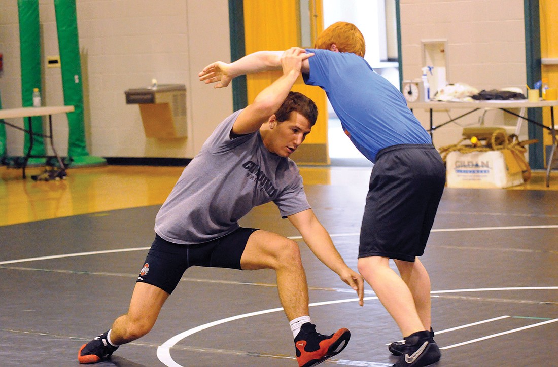 Ohio State University redshirt sophomore and NCAA 133-pound champion Logan Stieber works with Palm Harbor sophomore Jared Prince during Lakewood Ranch HighÃ¢â‚¬â„¢s wrestling camp with OSU coach Tom Ryan July 5 to July 7.