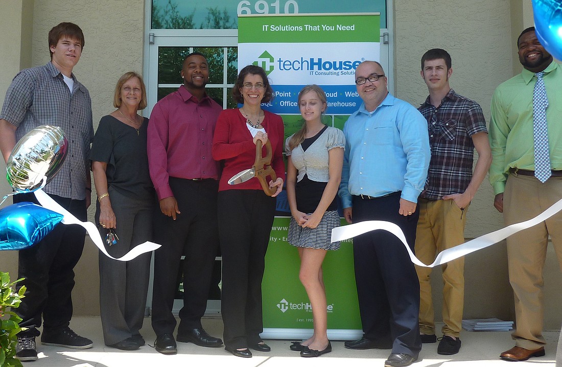 Representatives of TechHouse held a ribbon-cutting ceremony July 3.  Photo courtesy of Maureen Flaherty.
