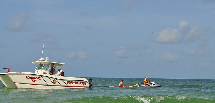 Longboat Key firefighters used the department's new rescue boat during drills with Manatee County lifeguards that involved a coordinated patient transfer from the lifeguards' Jet Ski and sleds to the boat.