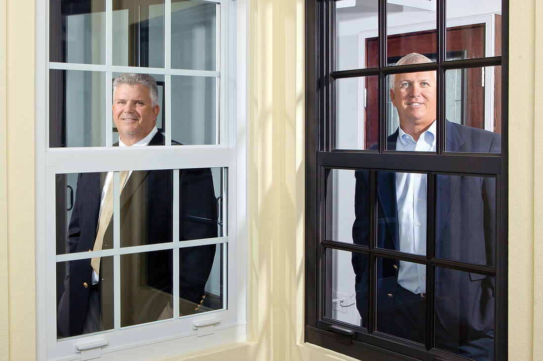 Universal Window Solutions owners Bob Smith, right, and Rocky Smith expect a new headquarters with a larger showroom to pay for itself through more revenue. Photo by Mark Wemple.
