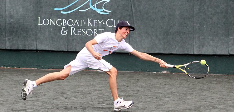 Thibaulg Miller, 15, reaches out to hit a one handed backhand during tennis camp, Tuesday, July 24, at the Longboat Key Club Tennis Gardens.
