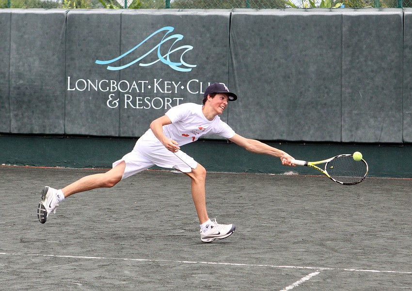 Thibaulg Miller, 15, reaches out to hit a one handed backhand during tennis camp, Tuesday, July 24, at the Longboat Key Club Tennis Gardens.
