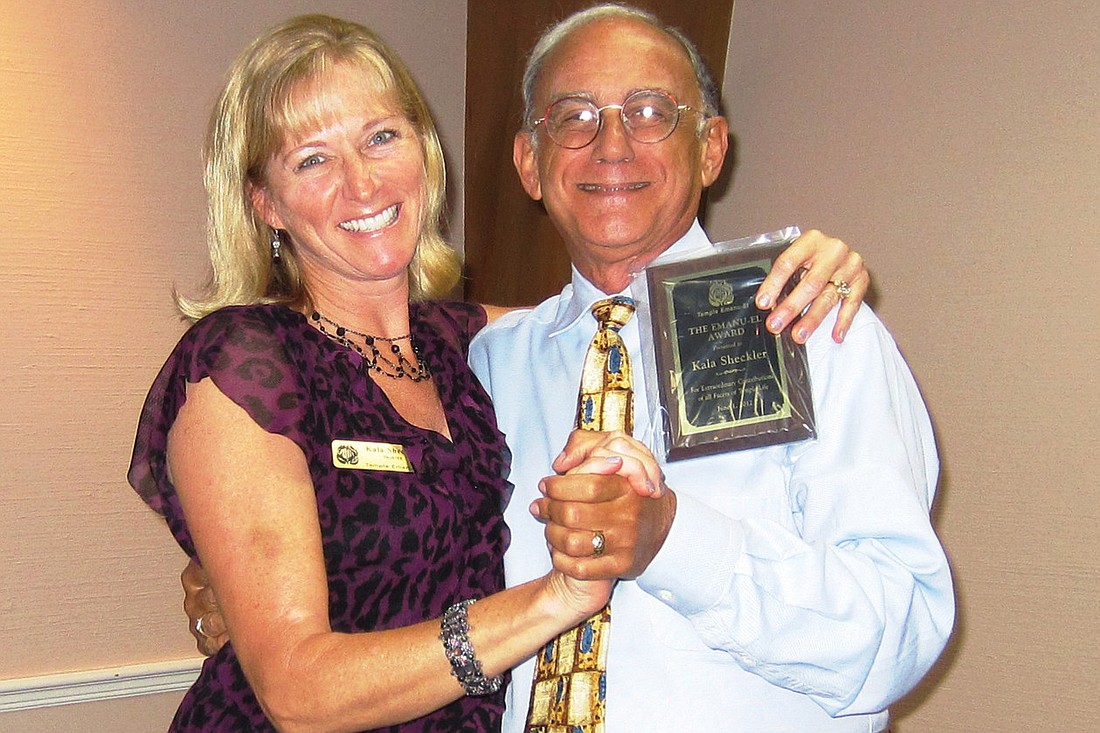 Kayla Sheckler accepted the Emanu-El Award from Temple President Michael Richker.