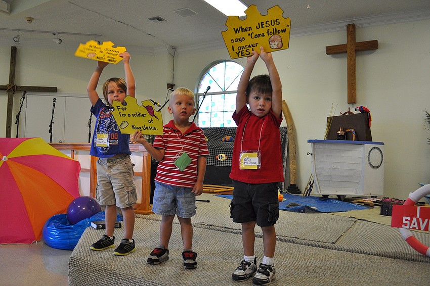 Jake Stanton, Jake Johnson and Zach McClung held lead children in a song.