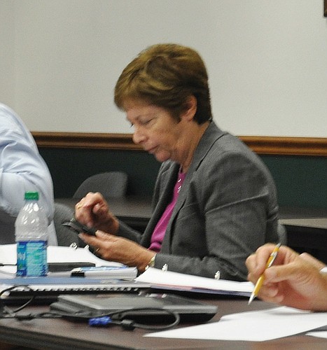 Sarasota County Commissioner Nora Patterson schedules the next West Coast Inland Navigation District meeting on her new Droid smart phone.
