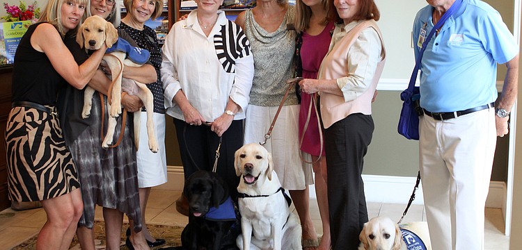 The dogs, trainers and main players behind the Premier Sothebyâ€™s and Southeastern Guide Dogs event gather together, Thursday, July 26, at Premier Sothebyâ€™s.