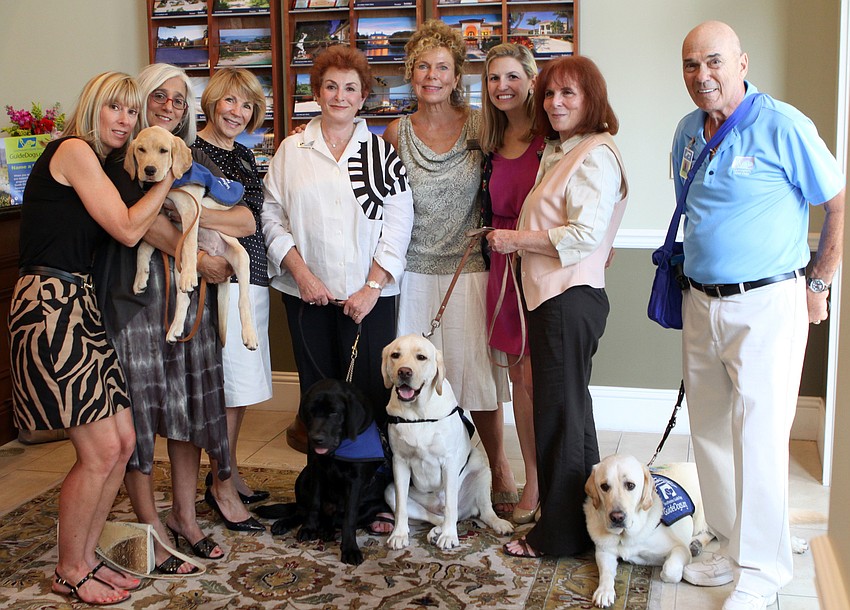 The dogs, trainers and main players behind the Premier Sothebyâ€™s and Southeastern Guide Dogs event gather together, Thursday, July 26, at Premier Sothebyâ€™s.