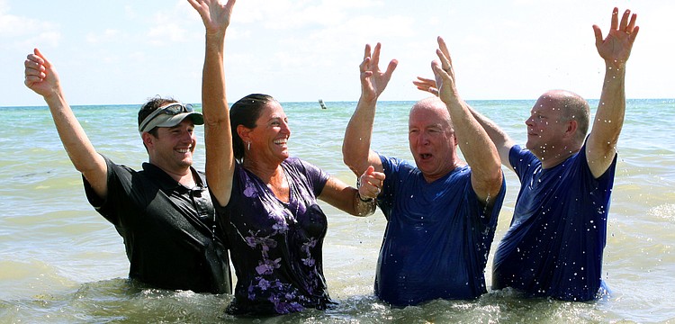 Pastor Craig King and Ed Coil, Discipleship Lead Coach, prepare Caroline and Parker Thurman to be baptized, Sunday, July 30.
