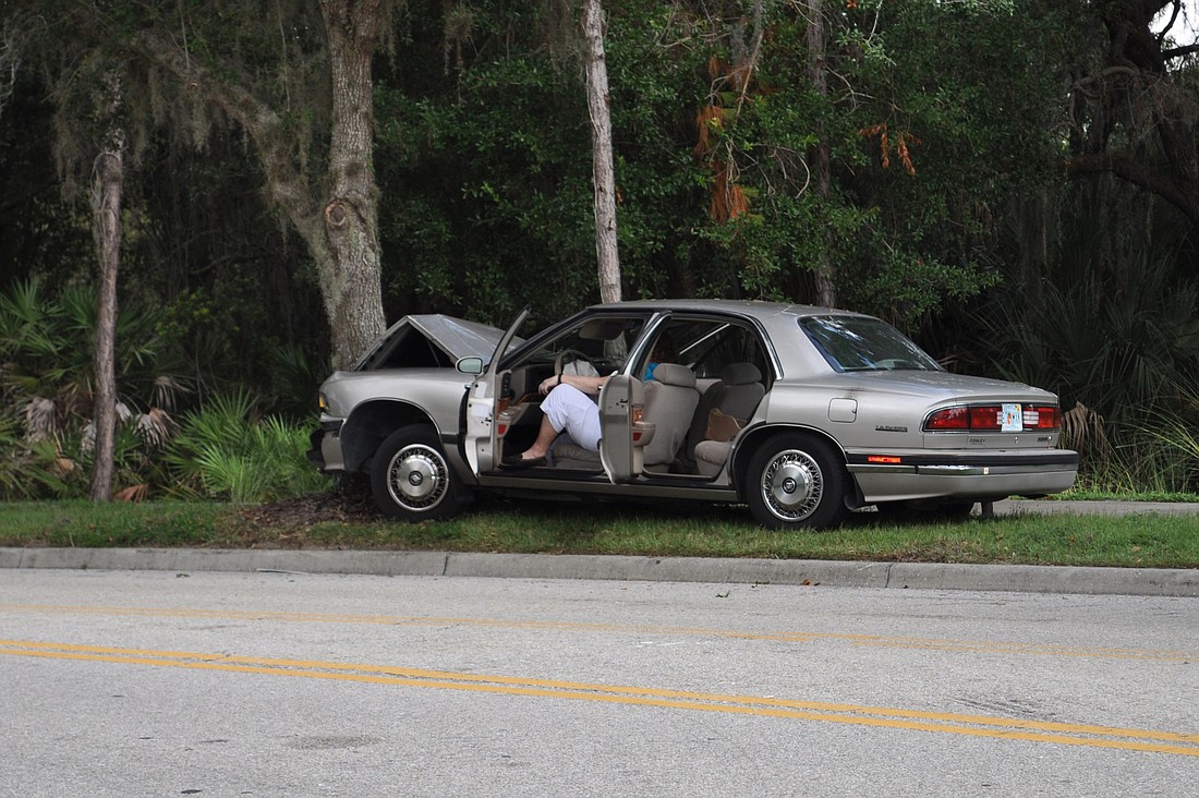 A sedan crashed head-on with a tree.